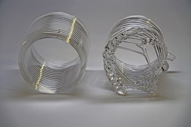 Photo of two coiled glass tubes, one smooth, one bumpy.