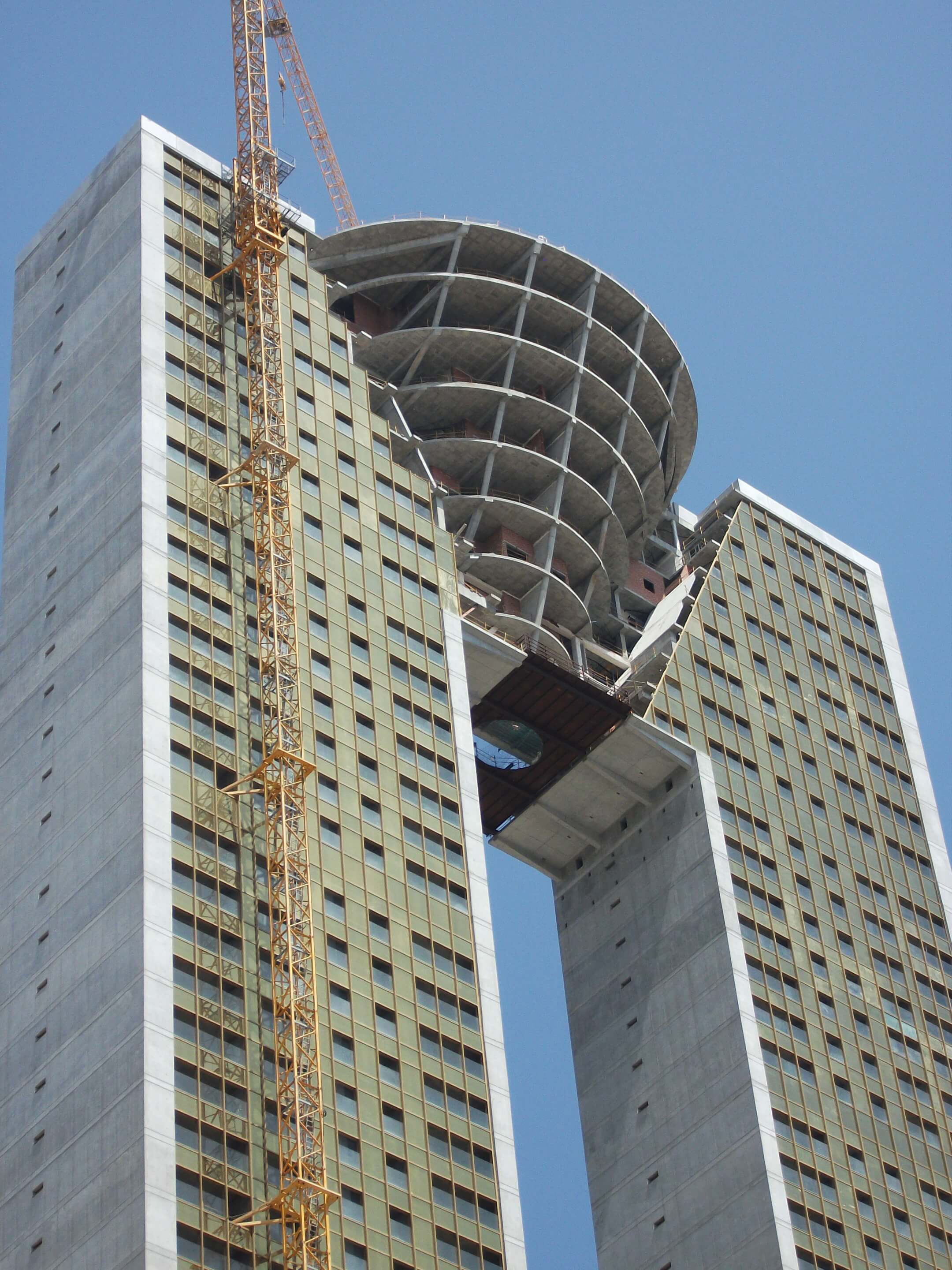 an M-shaped residential tower under construction