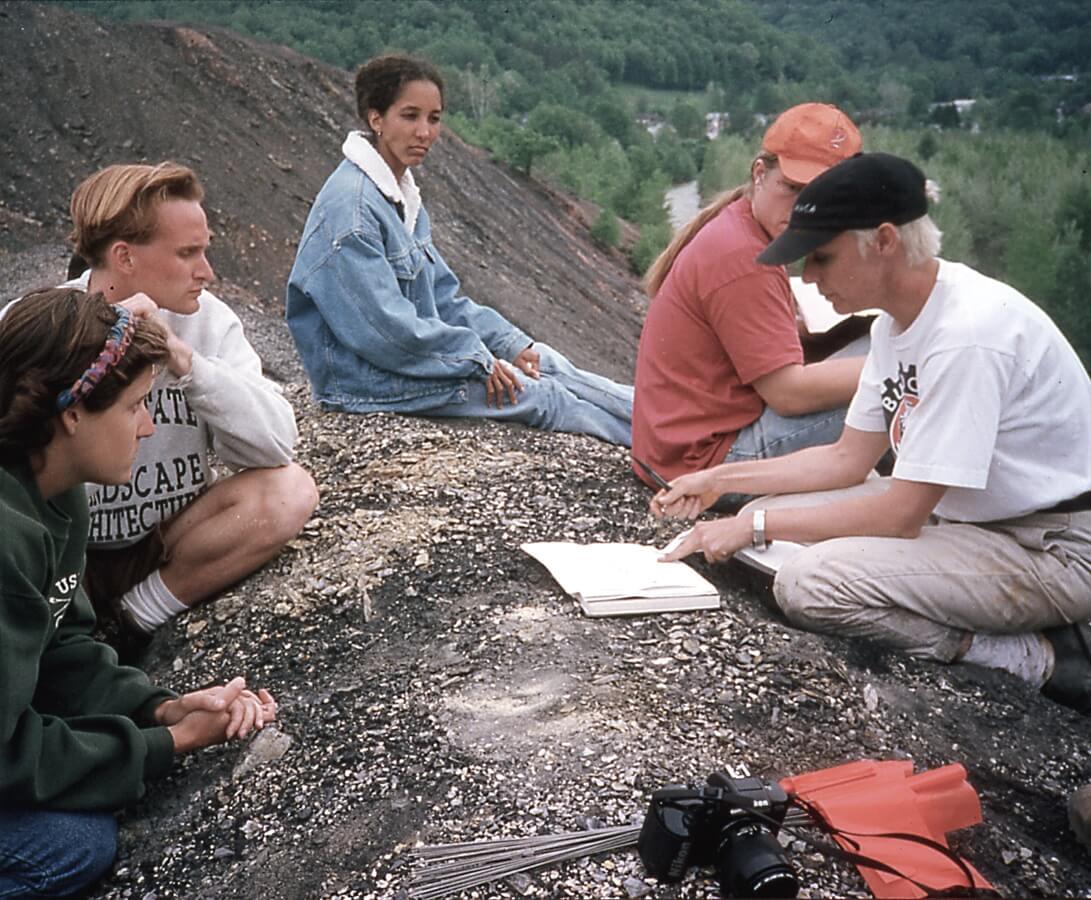 1990s photo of a group meeting at a former industrial site