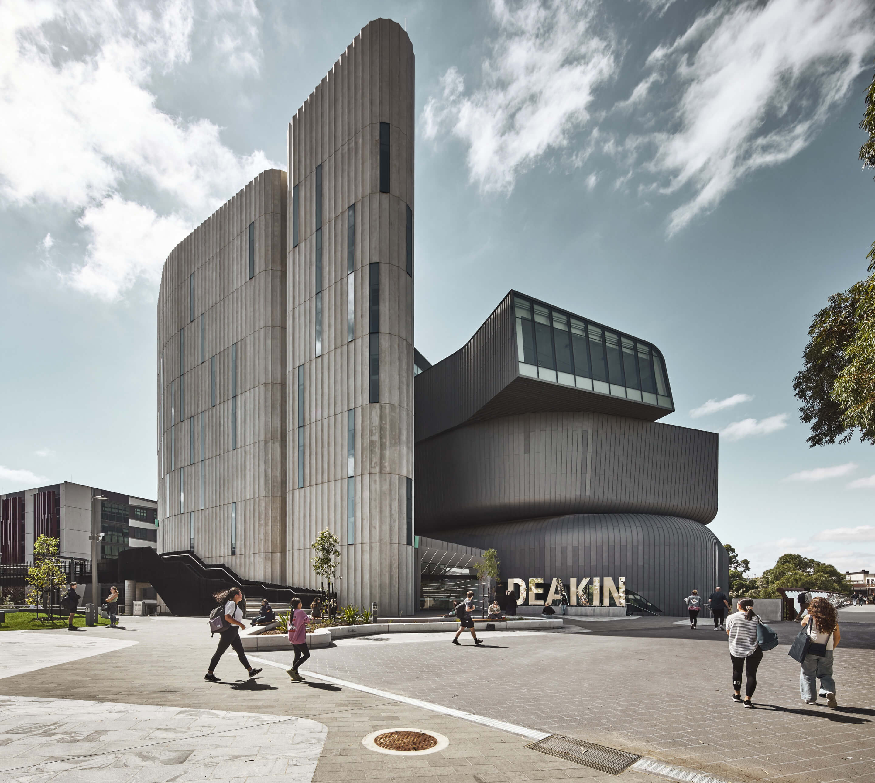 The fluted Deakin Law Building at Deakin University Melbourne Burwood Campus  hopes to charm students back to campus