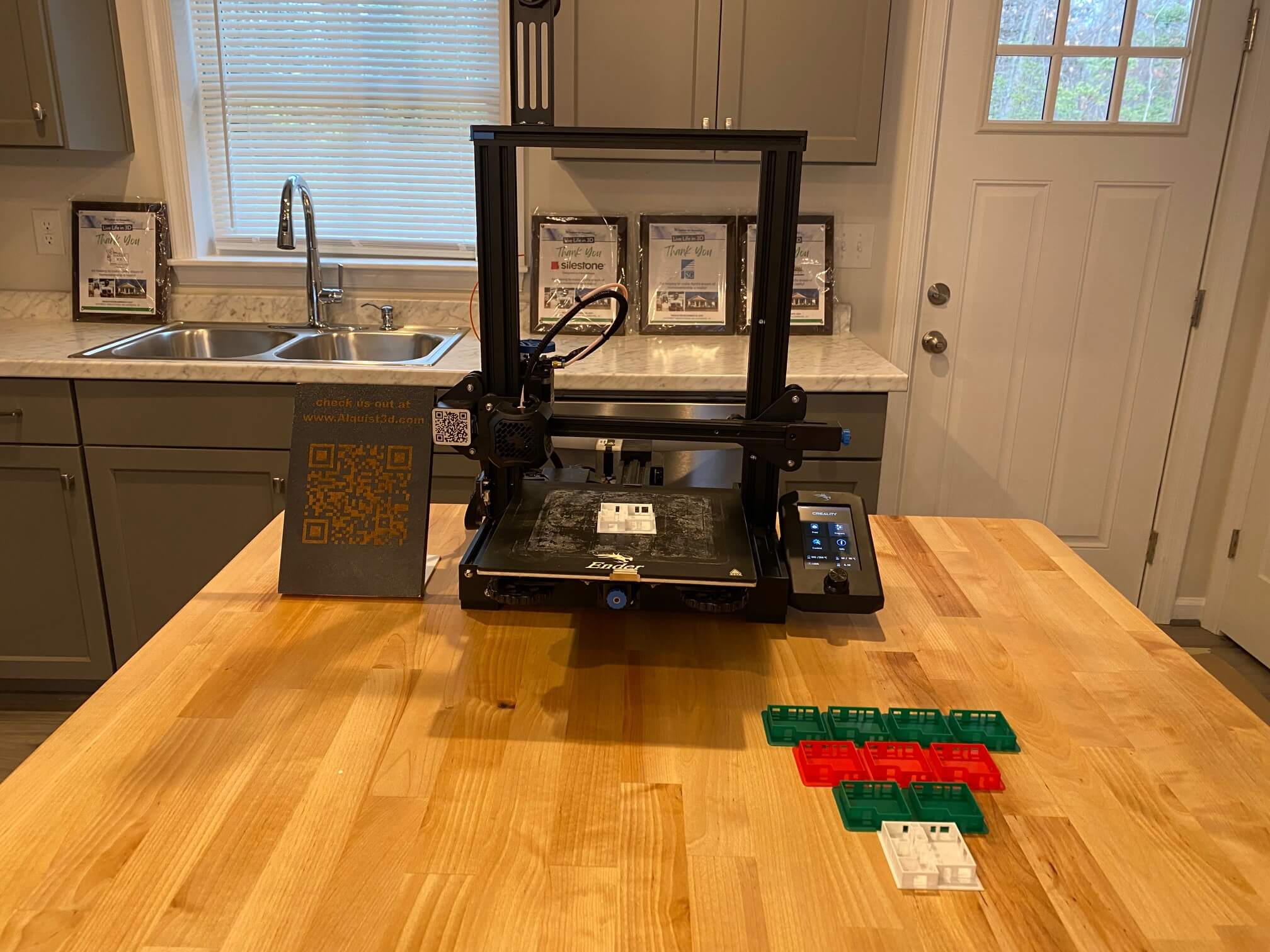 a tabletop 3d printer on display in a kitchen