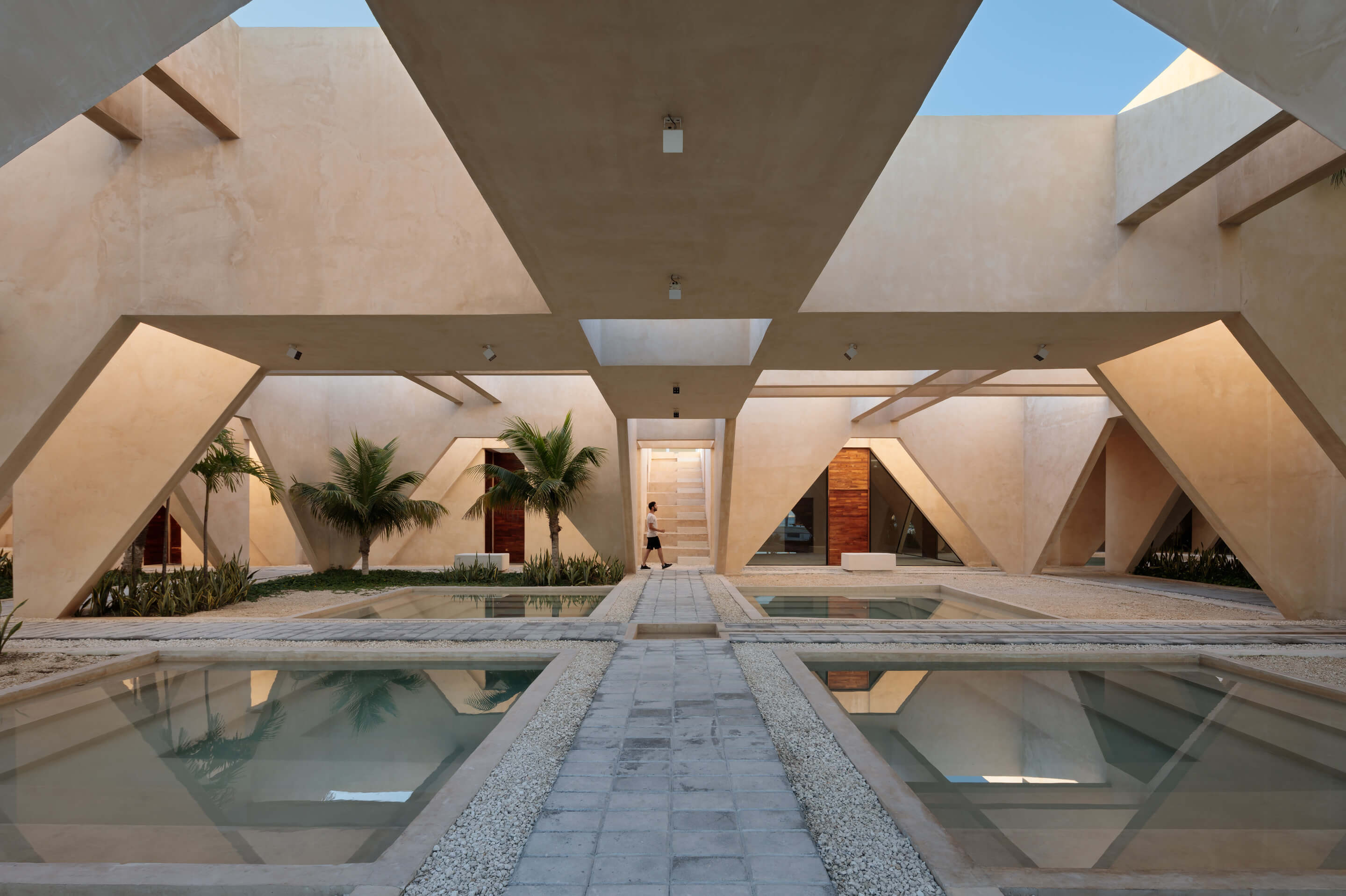 a semi-enclosed courtyard with reflecting pools