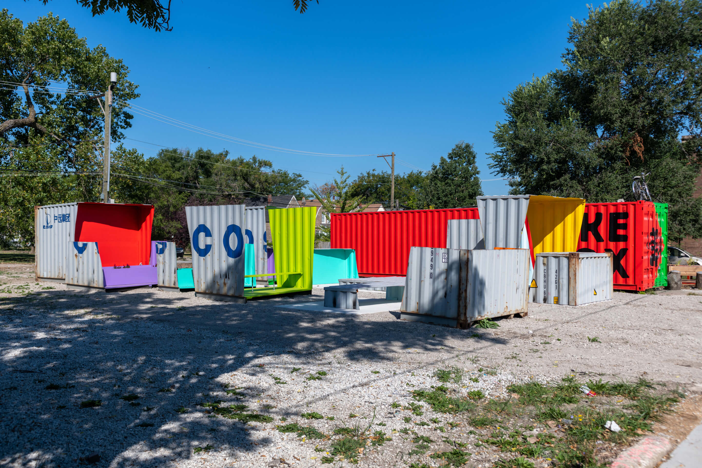 deconstructed shipping containers on a vacant lot
